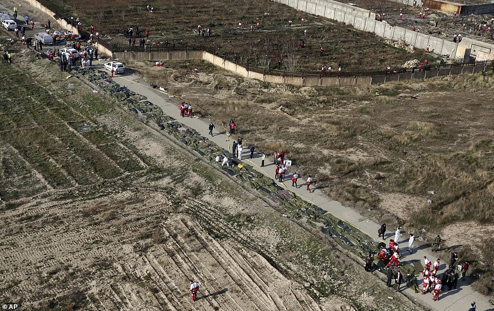 https://i.dailymail.co.uk/1s/2020/01/08/10/23143302-7863359-This_aerial_view_of_the_crash_site_shows_bodies_of_the_crash_vic-m-66_1578479633289.jpg