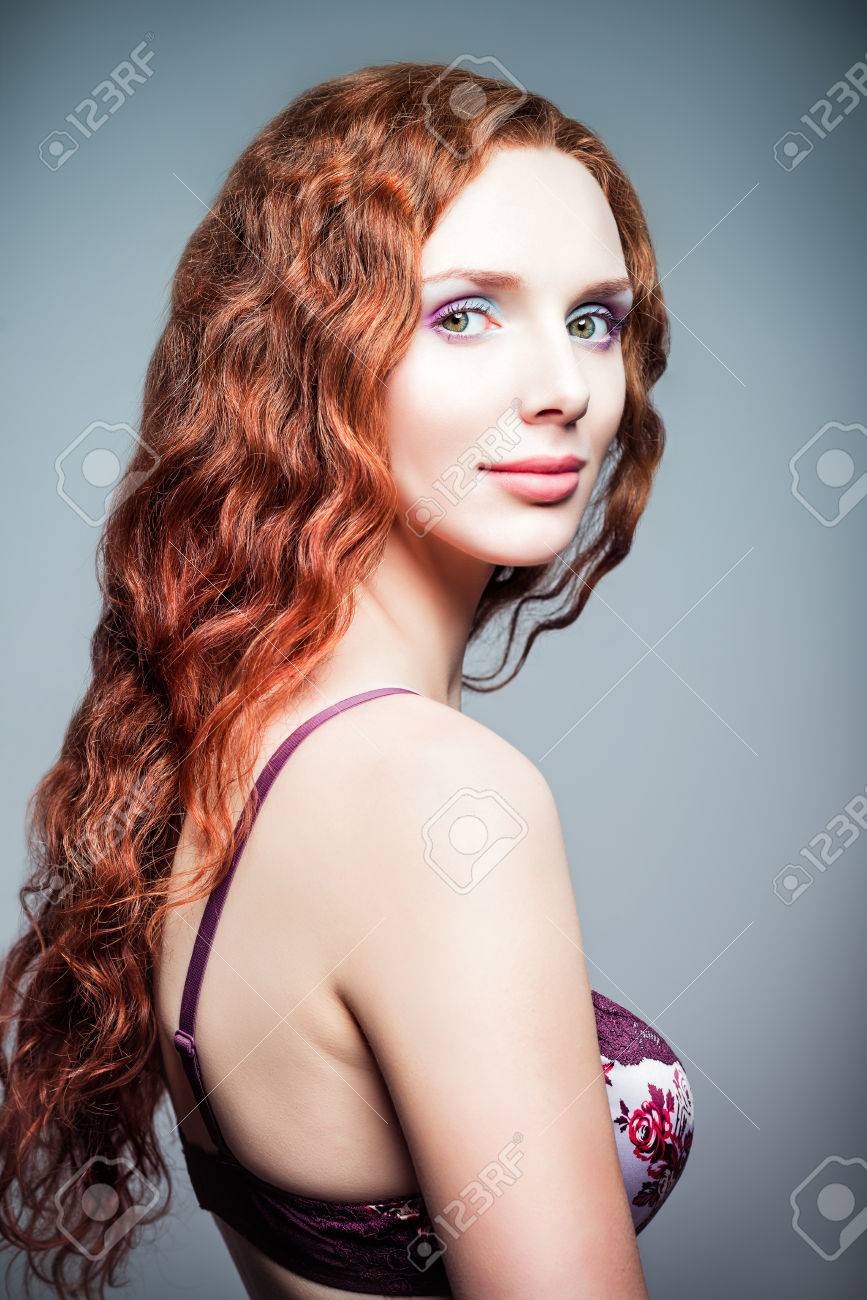 http://previews.123rf.com/images/jetrel/jetrel1408/jetrel140800003/30606610-Closeup-studio-portrait-of-a-pretty-redhead-woman-Half-turned--Stock-Photo.jpg