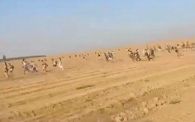 https://static.timesofisrael.com/www/uploads/2023/10/Running-from-scene-640x400.jpg