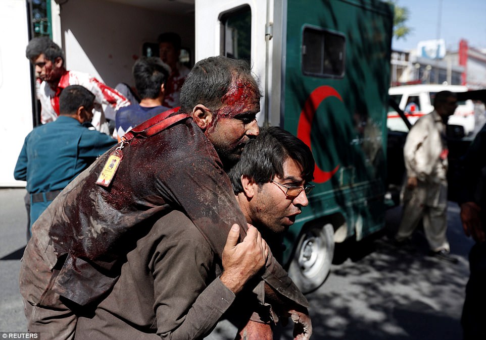http://i.dailymail.co.uk/i/pix/2017/05/31/08/40F406C300000578-4557562-An_Afghan_man_carries_an_injured_man_to_a_hospital_after_the_mas-a-23_1496216848821.jpg